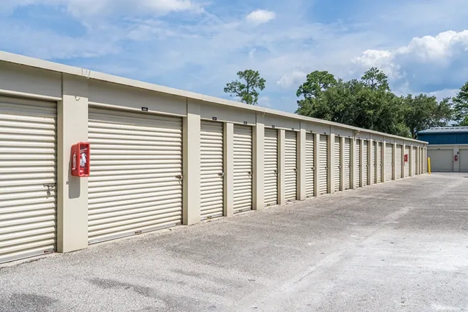 Outdoor drive-up storage units with roll-up doors for convenient access